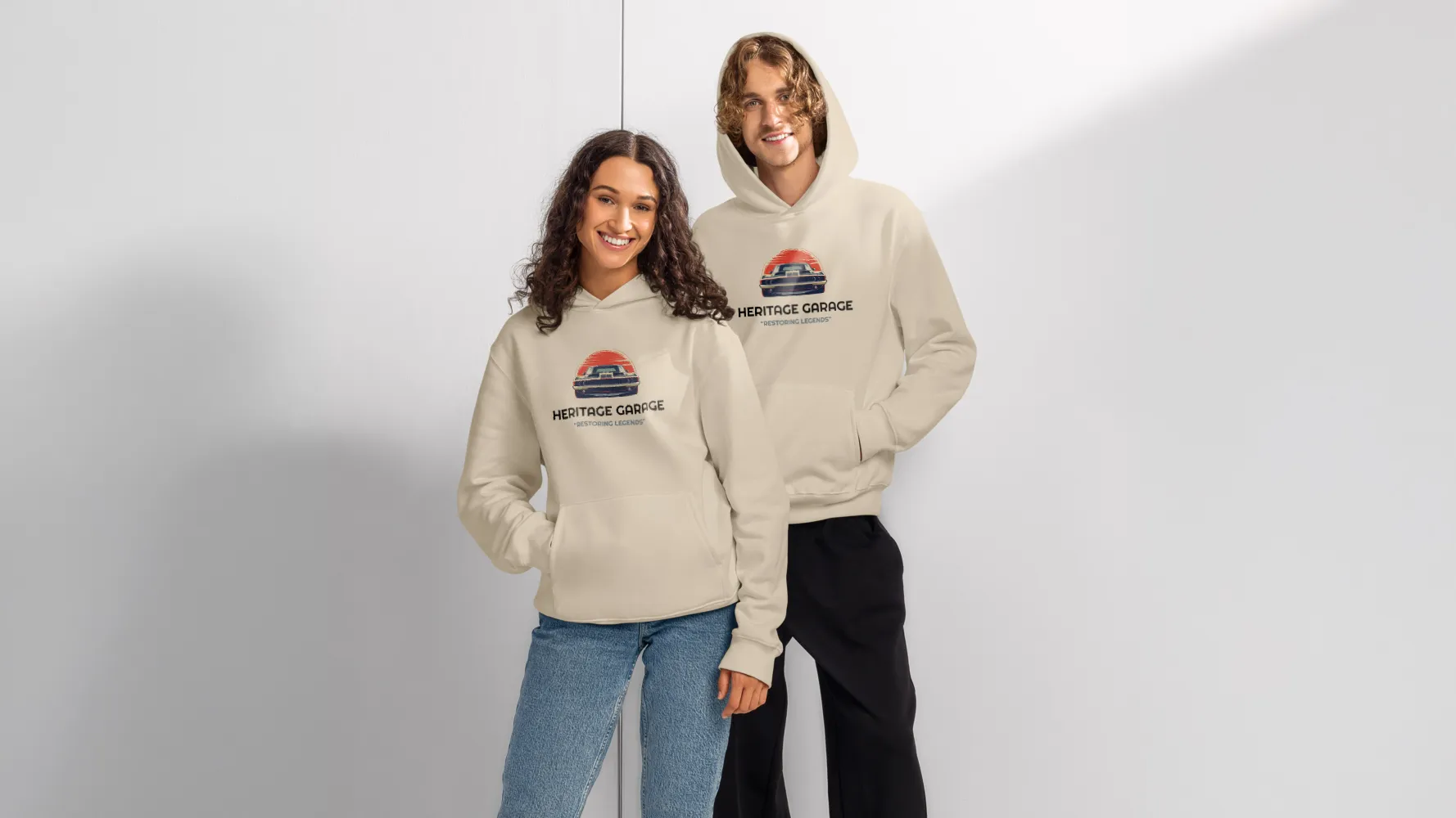 Two people wearing beige custom hoodies with a printed logo